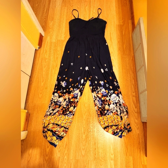 Maurices medium navy jumpsuit with slit pant legs that ties at bottom. - Picture 1 of 5